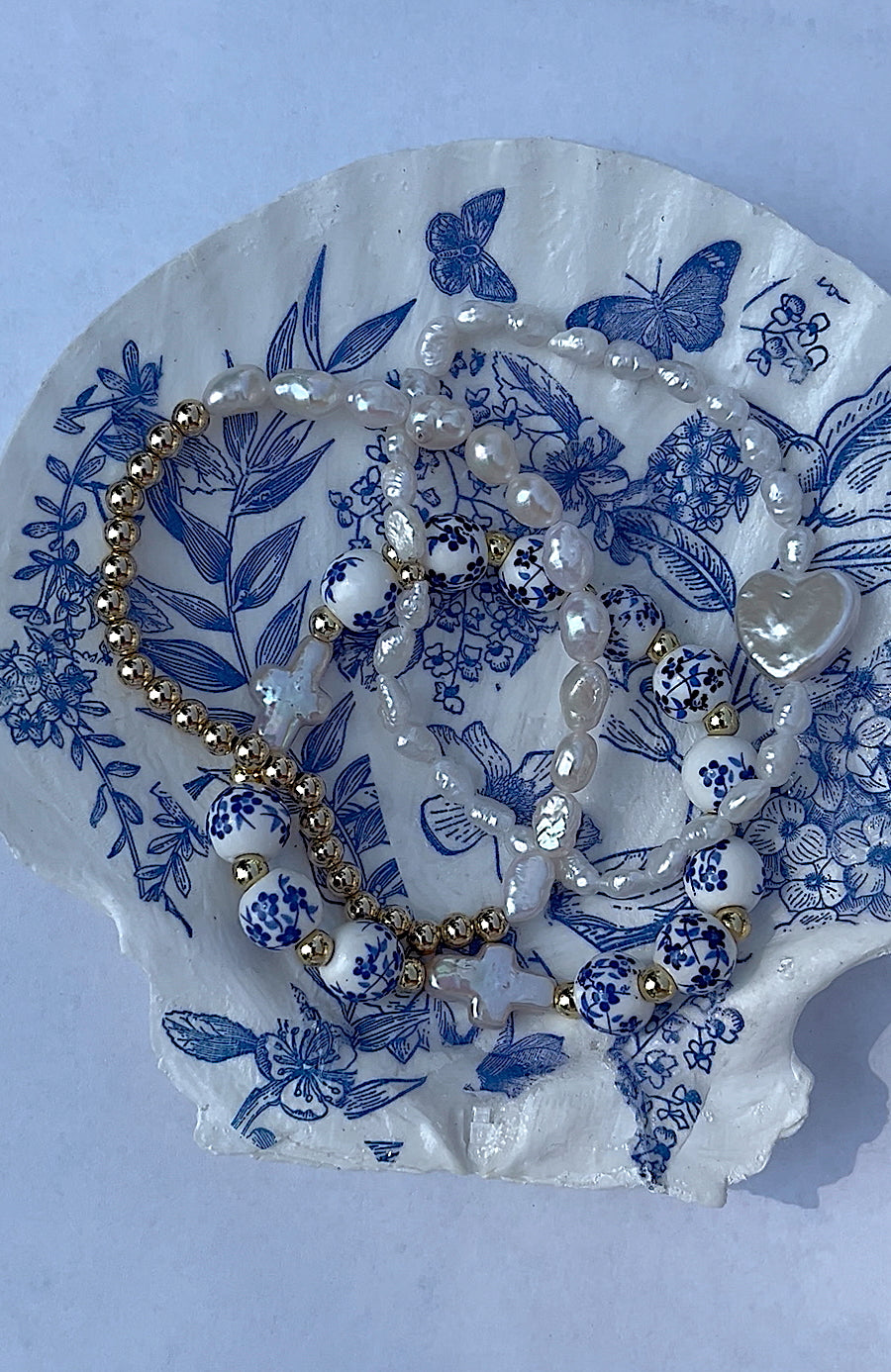 Blue floral pearl cross