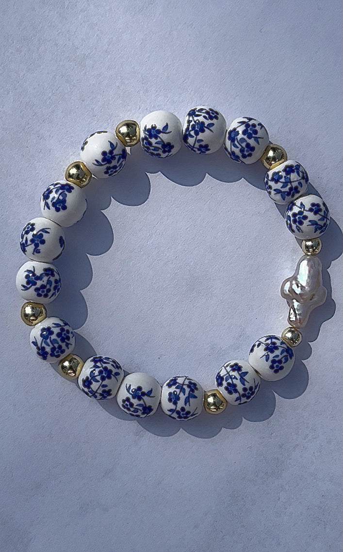 Blue floral pearl cross