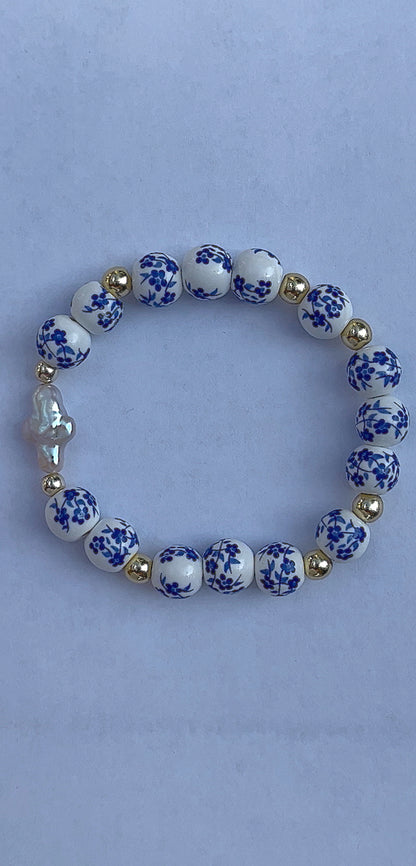 Blue floral pearl cross