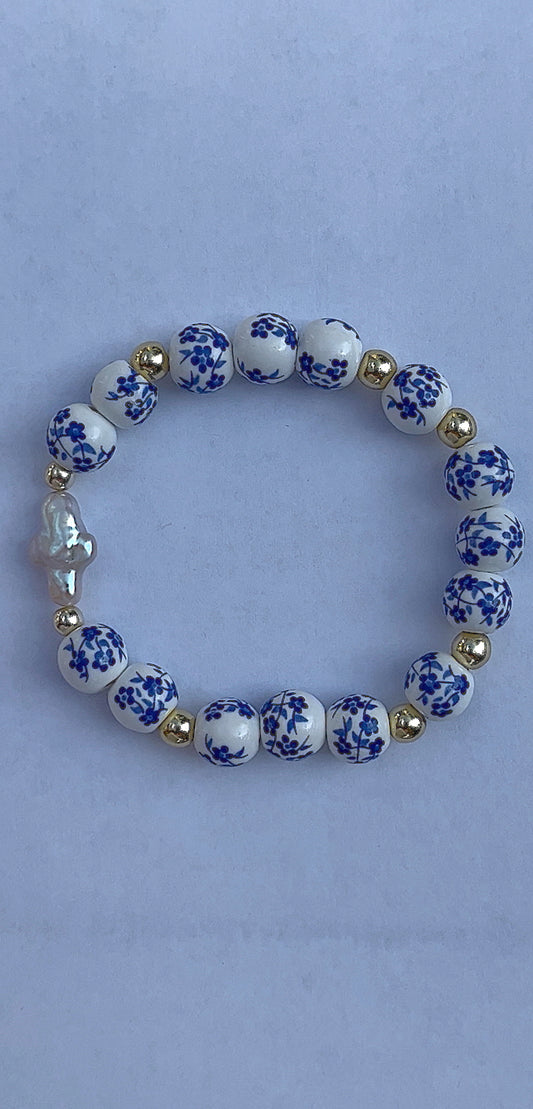 Blue floral pearl cross