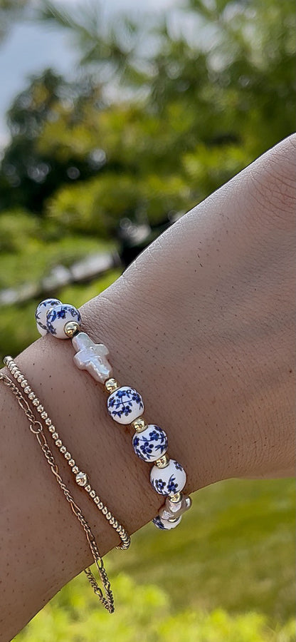 Blue floral double pearl cross