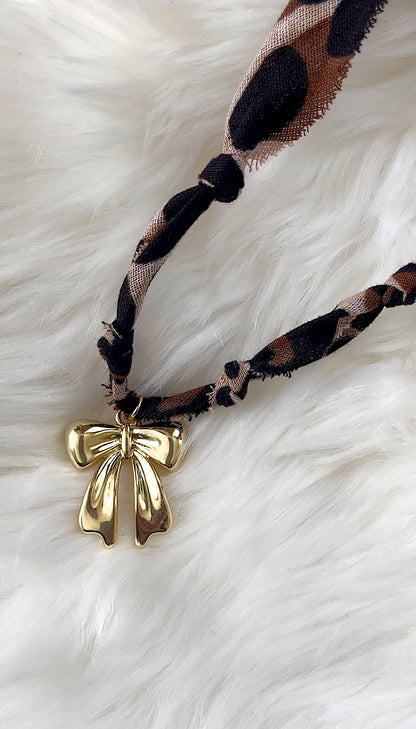 Leopard + bow necklace