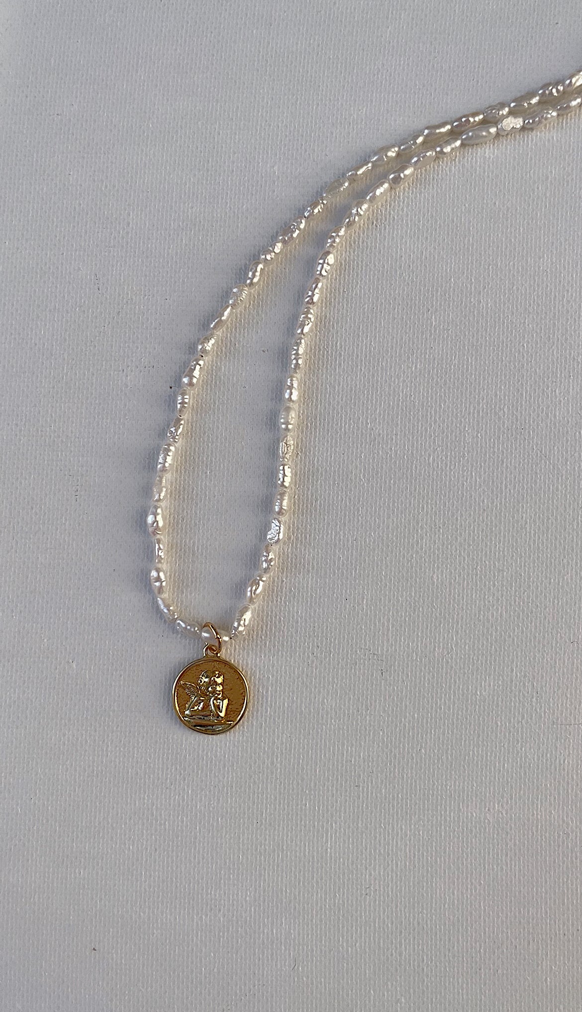 The cherub necklace