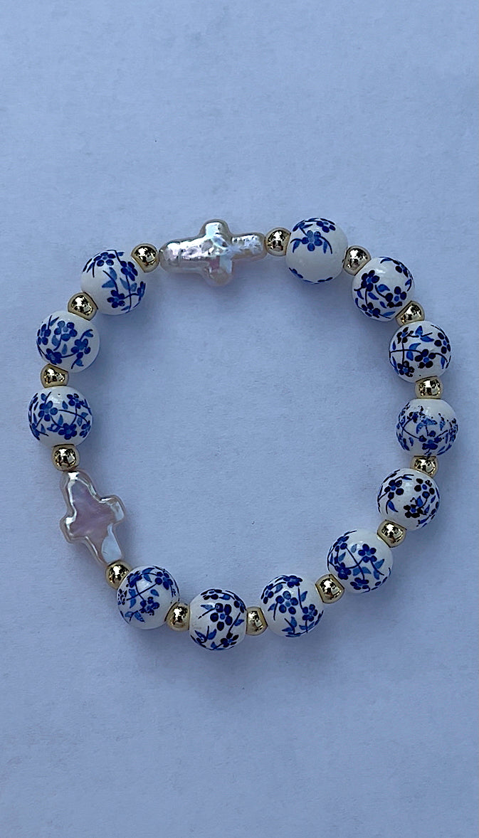 Blue floral double pearl cross