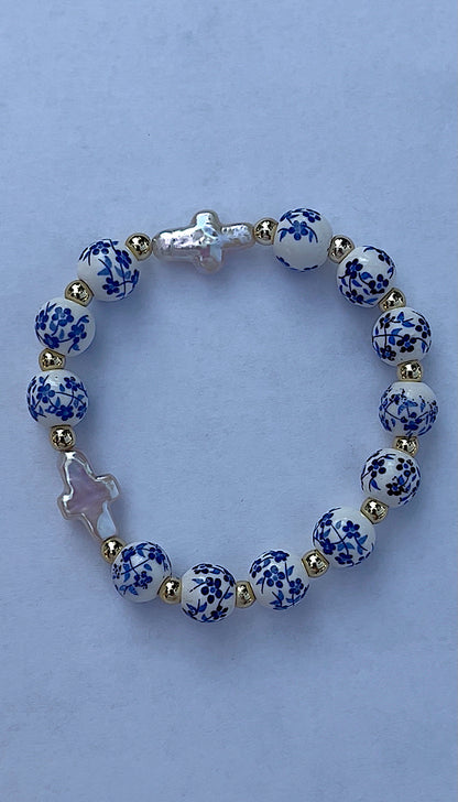 Blue floral double pearl cross